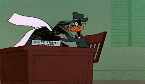 cartoon of daffy duck sitting at a desk and furiously typing on a type a writer