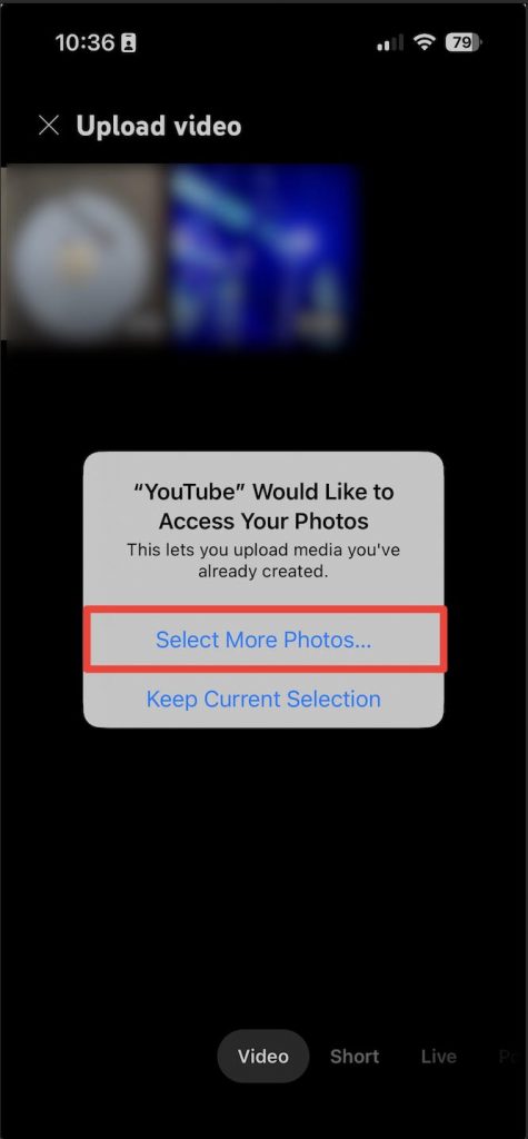 Blurred image of a video upload screen in the YouTube app, the video crop selection tool highlighted.