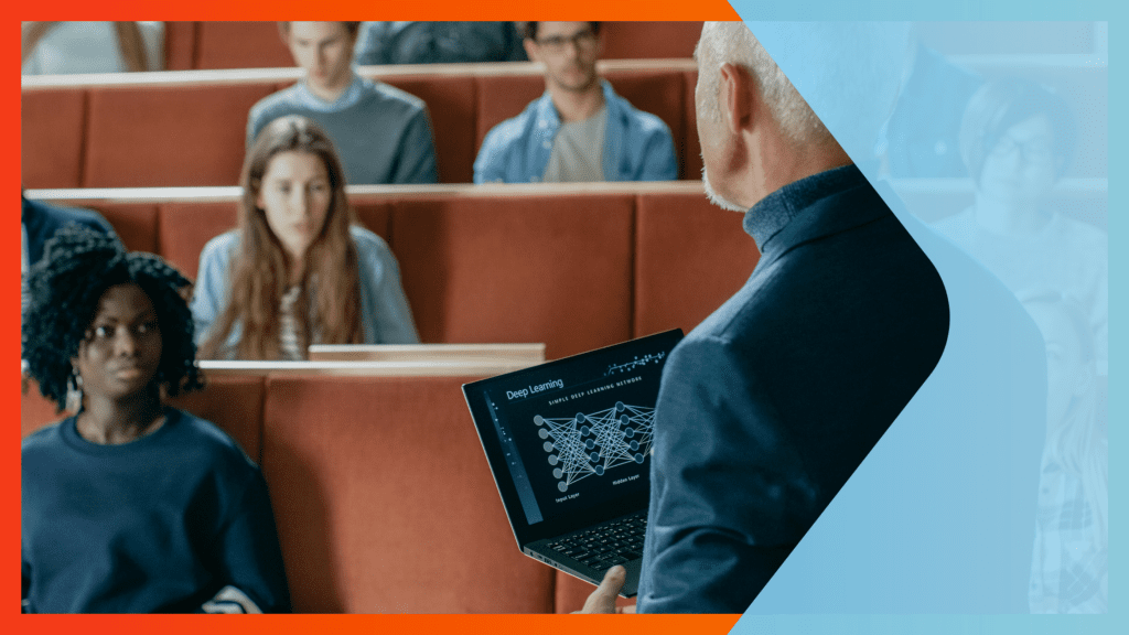 Professor holding laptop in lecture hall