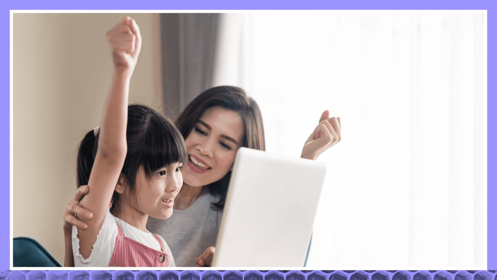 Child and parent excited using laptop