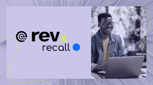 Image features a purple background with both Rev and Recall.ai's logos in white on the left side. A photo of a Black male wearing round frame glasses and a denim jacket smiles while engaged on a Zoom call.